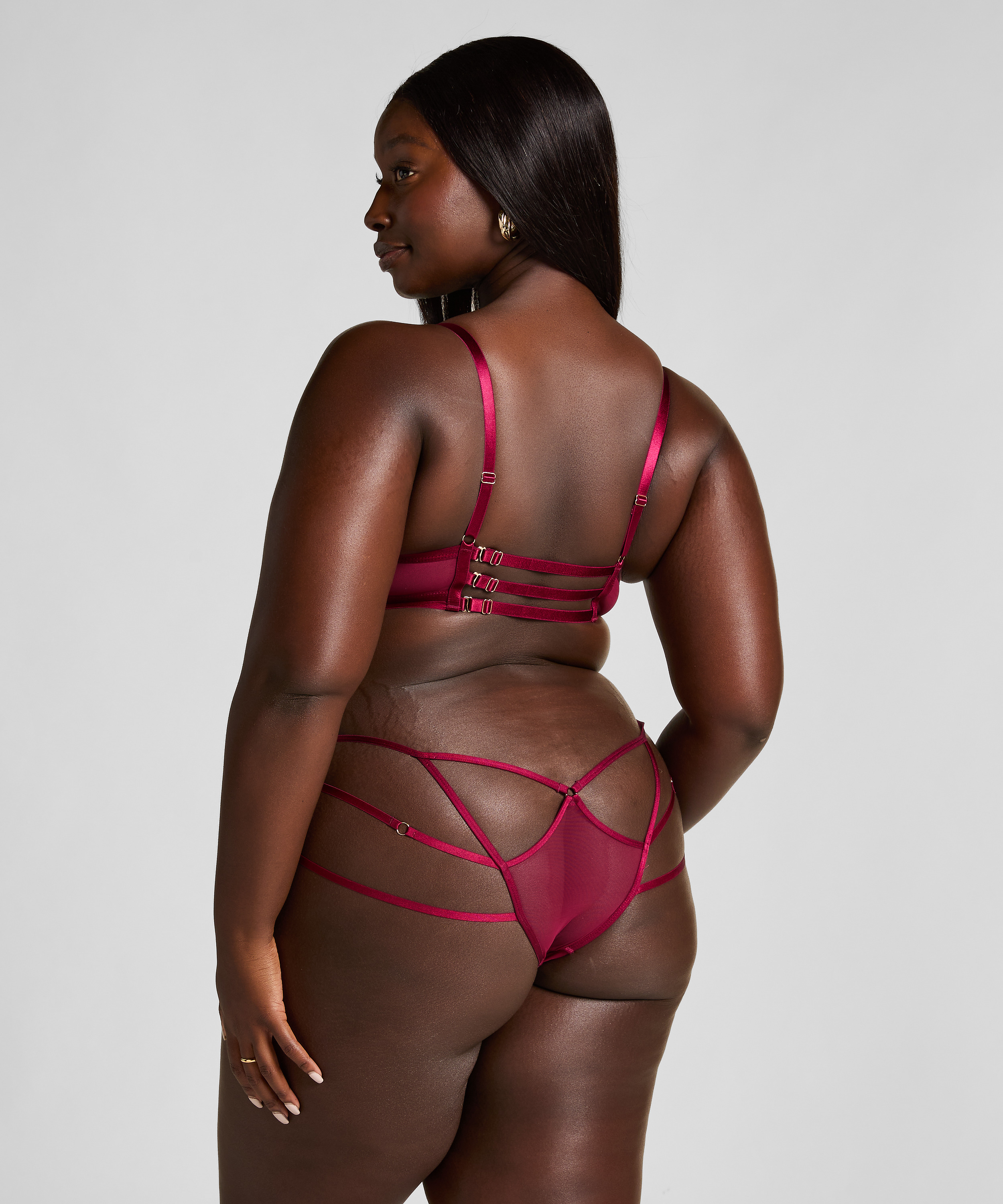 Slip brésilien ouvert Scarlett, Rouge, main